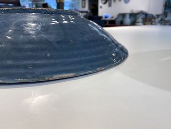 A Chinese monochrome blue Swatow dish with incised carp design, Ming